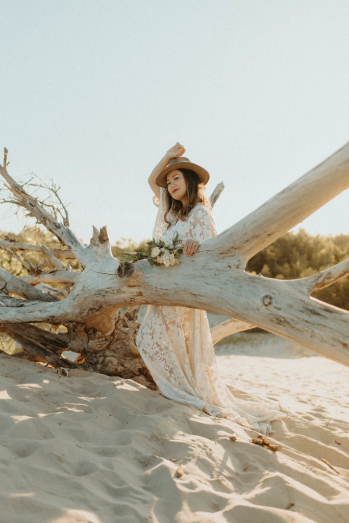 a bride wearing Reclamation Design lace gown for her desert elopement