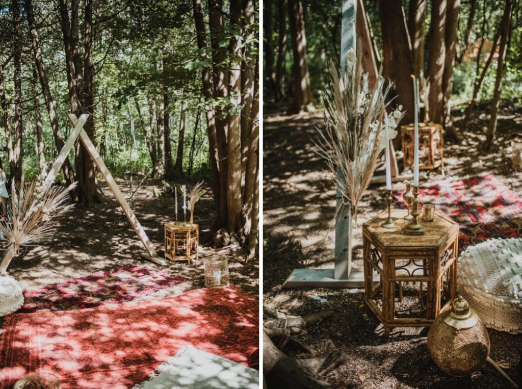 wooden triangle arch with florals and wedding details in forest