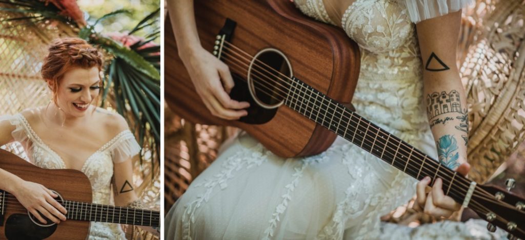 redhead in wedding dress playing acoustic guitar