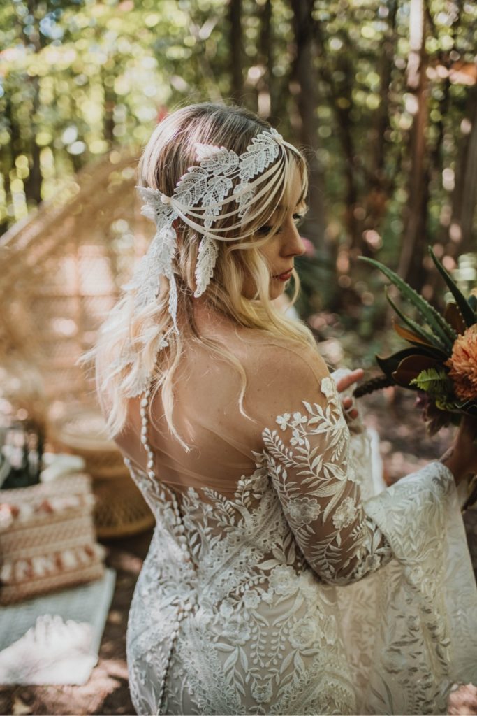 blonde bride in wedding dress and lace headpiece