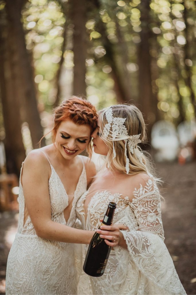 lesbian brides snuggling and laughing