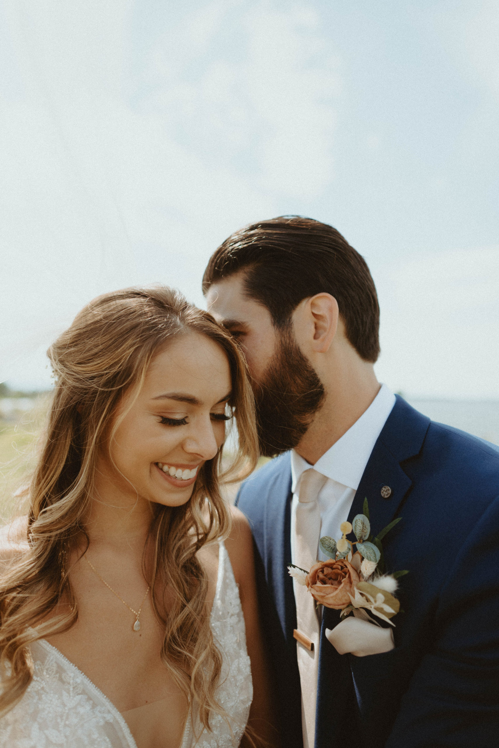 bride and groom smiling