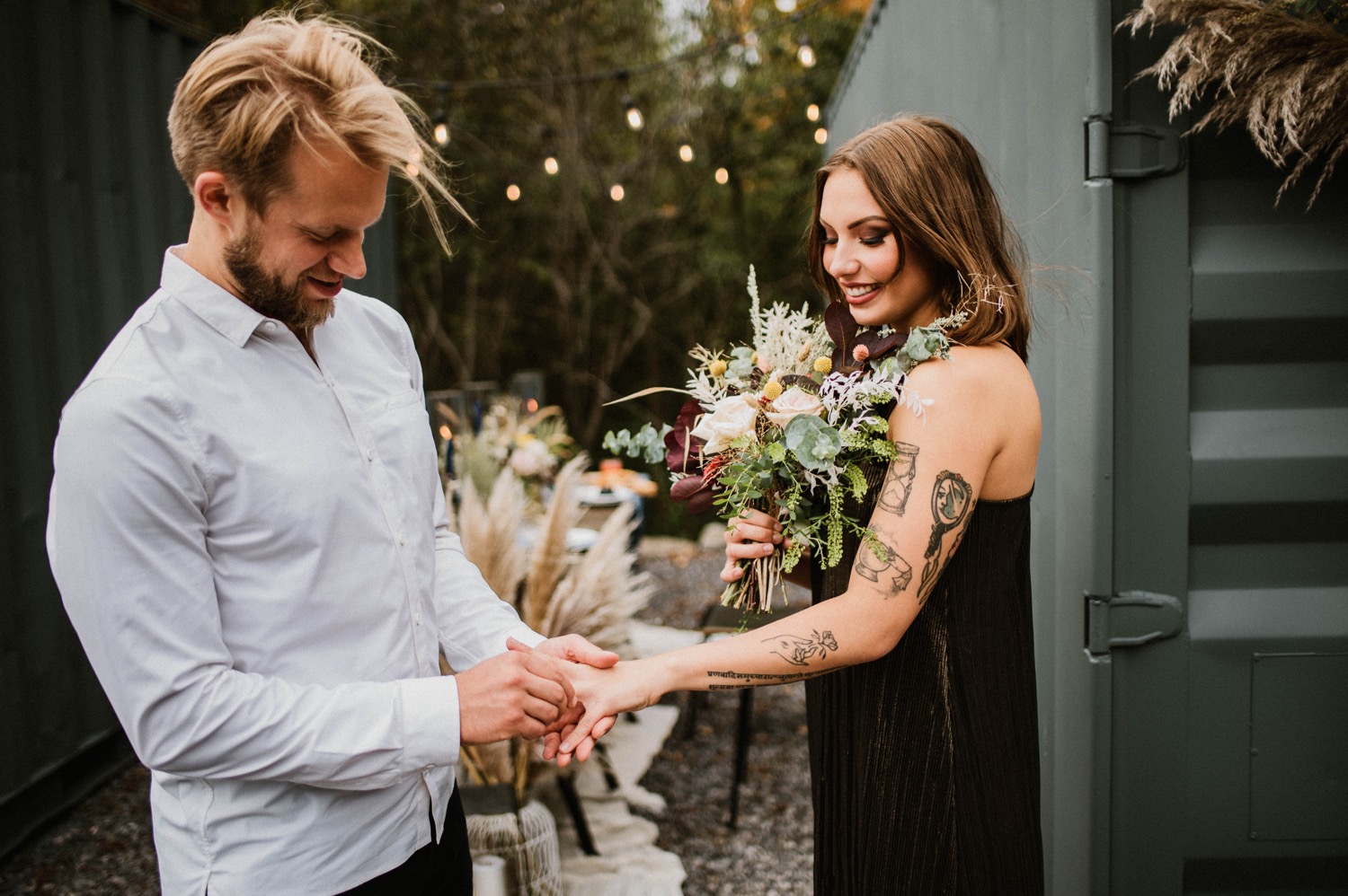 bride and groom exchanging rings at outdoor fall elopement