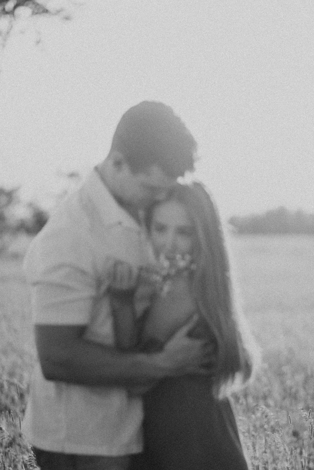 couples engagement photos in sunset field