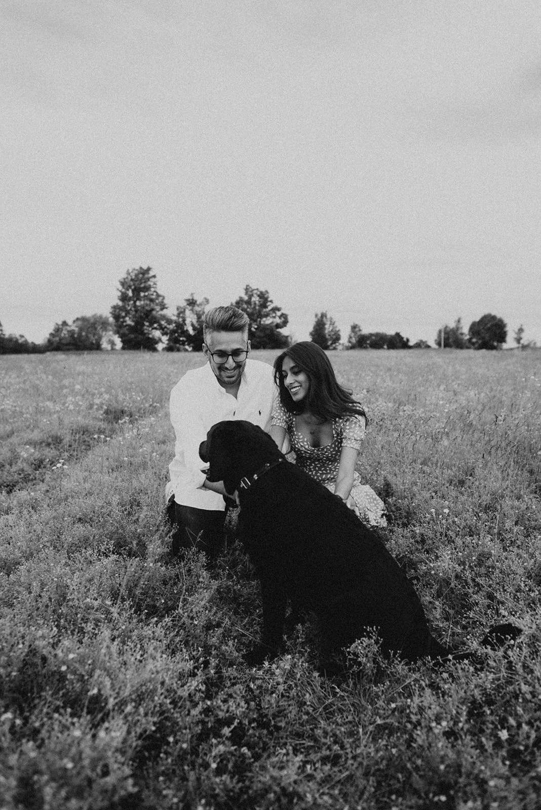couple with black lab