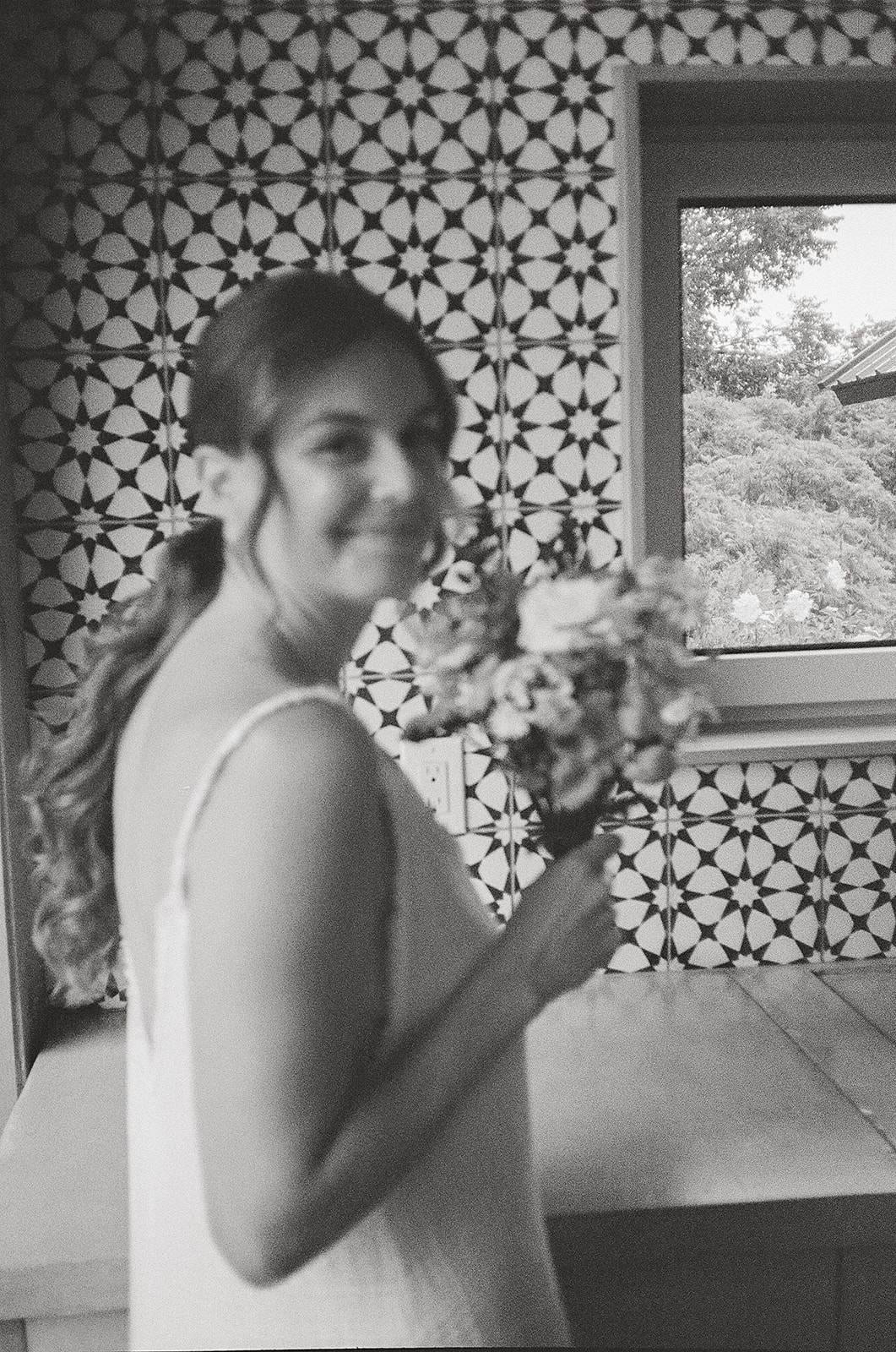 bride getting ready moment on black and white film