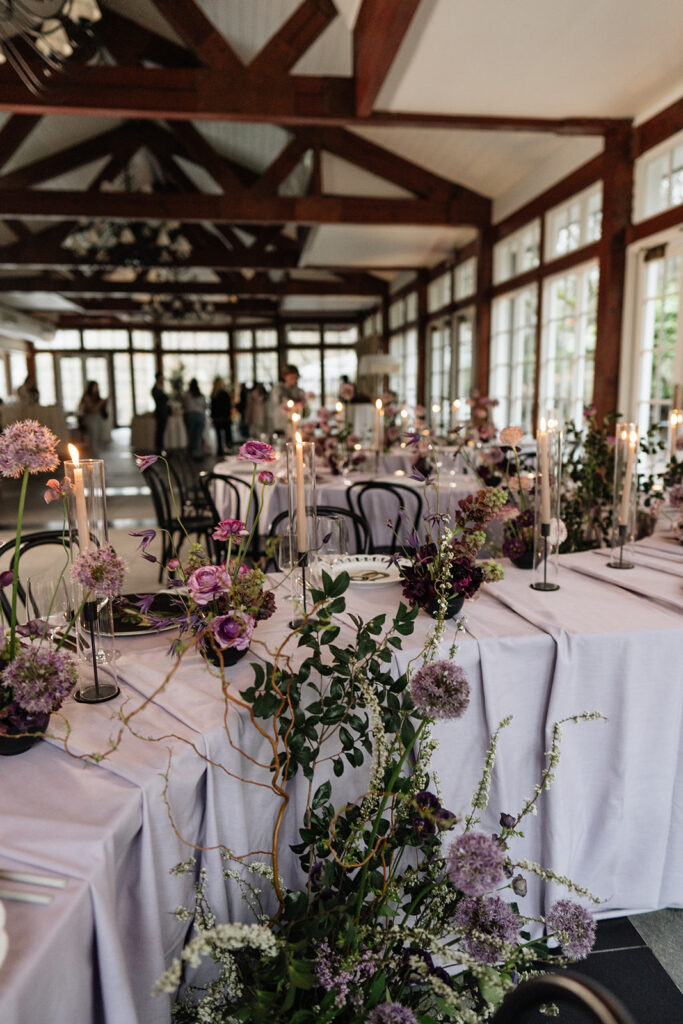 restaurant wedding tablescape with guests in background