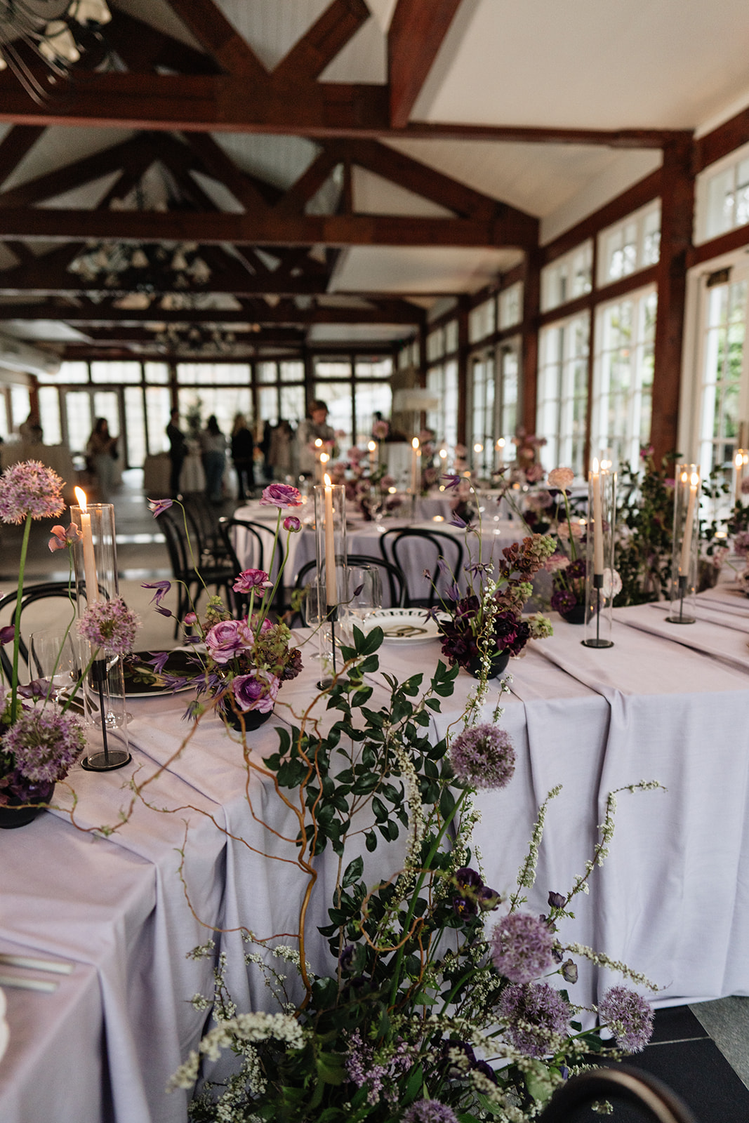 restaurant wedding tablescape with guests in background
